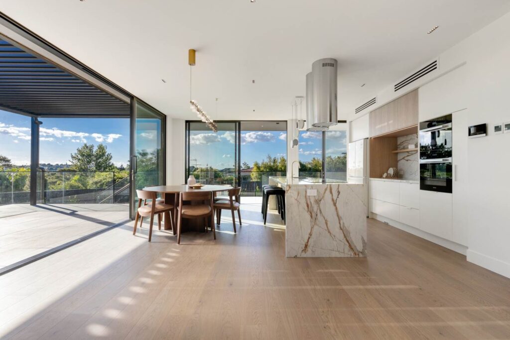 Natural Engineered oak flooring with view to outdoor dining area