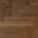 Mid brown European oak Herringbone floorboards - whiskey sour - close up