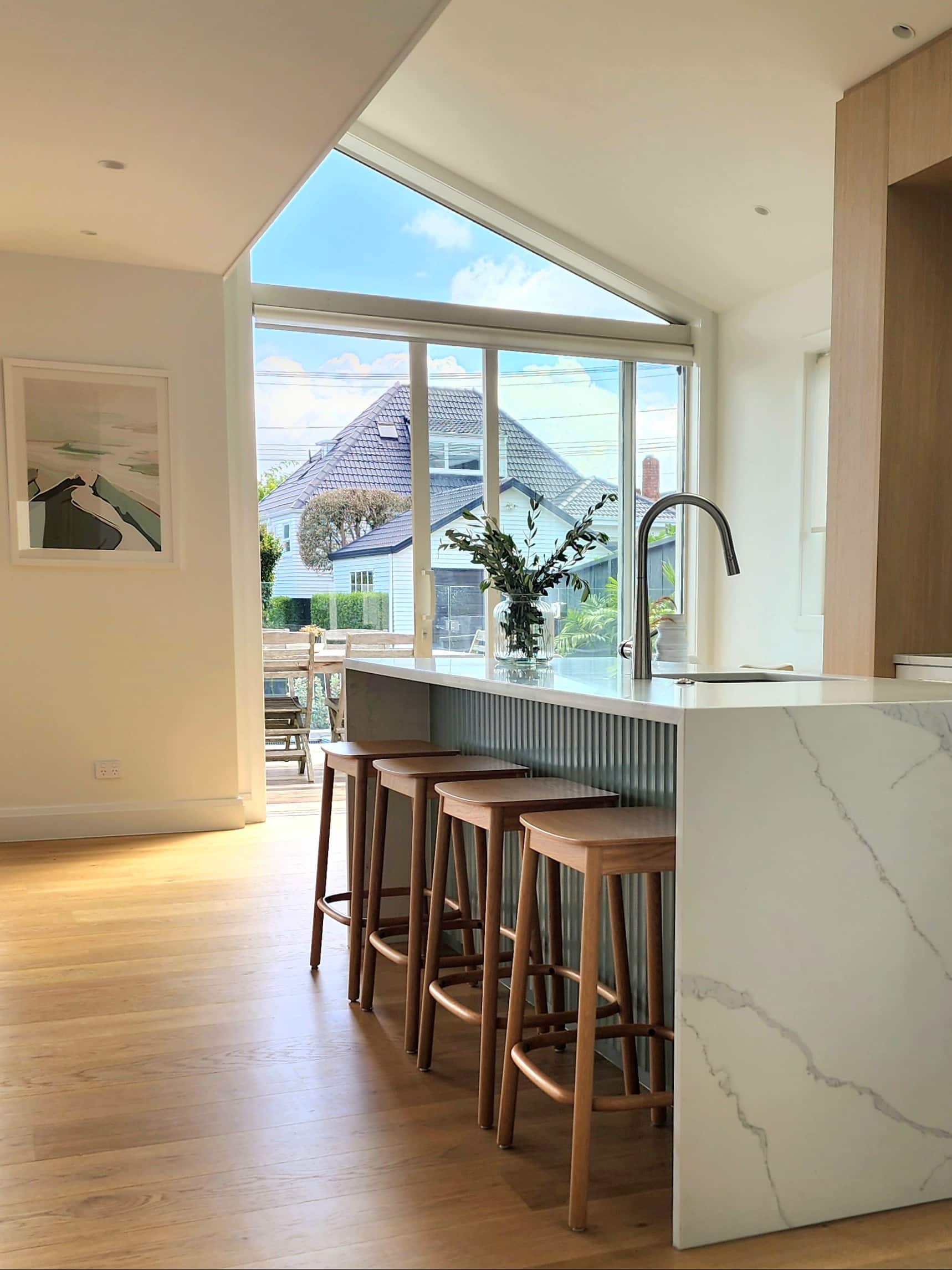 light natural wood flooring in open plan kitchen