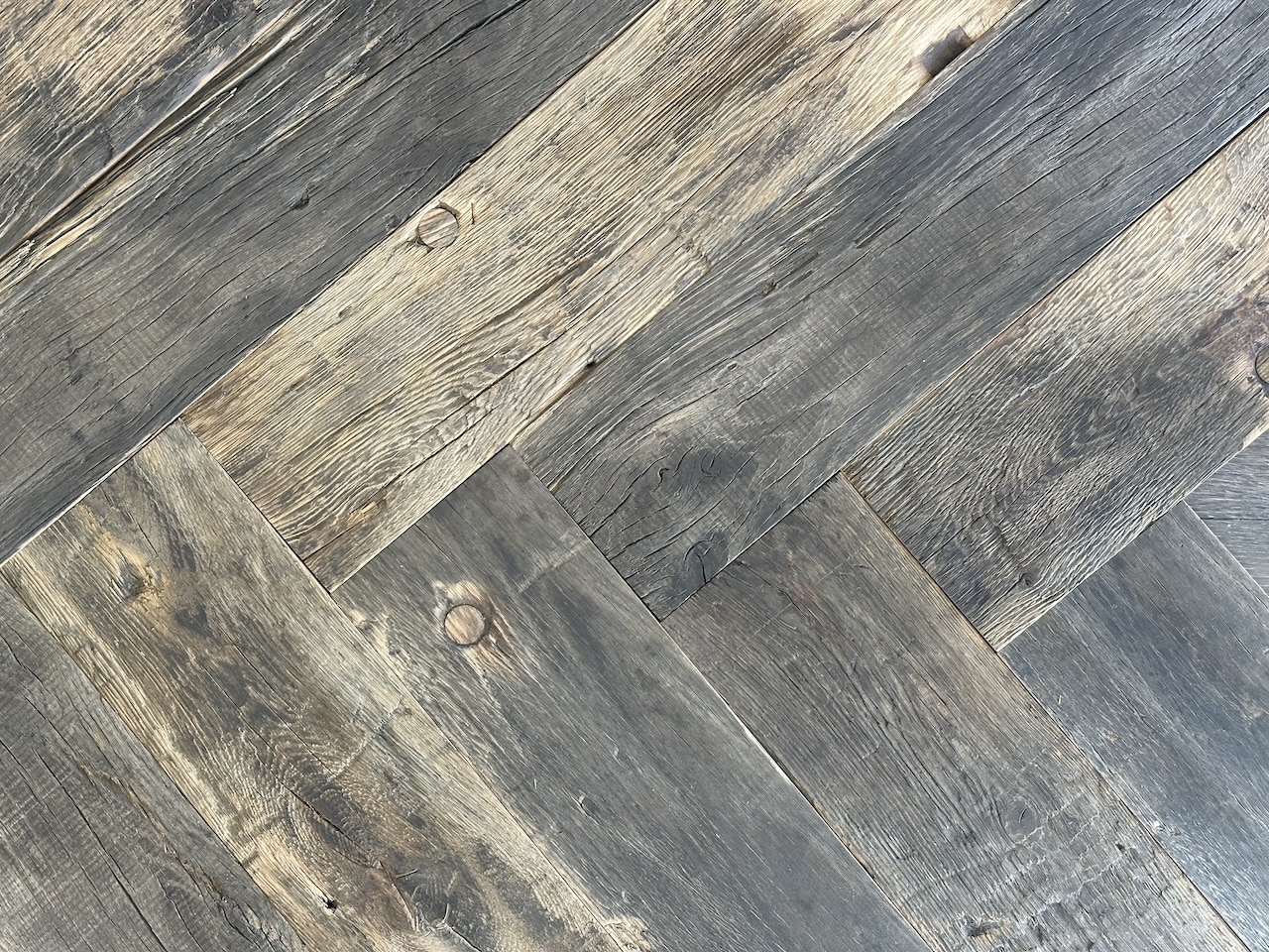 Natural oiled timber flooring - 1 (1) Reclaimed wood herringbone silver grey colour close up