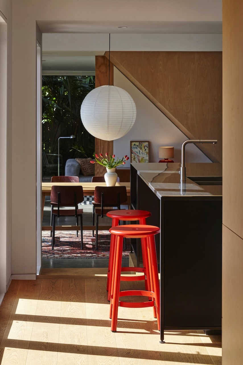 White oak hardwood flooring in open plan living dining with timber ceilings and a view